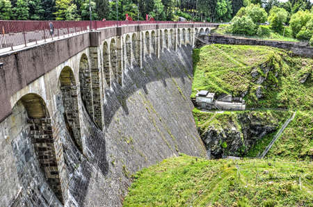 Robertville, Belgium, May 30, 2015: the barrage in the river Warche, constructed in 1928, seen from the northeast sideのeditorial素材