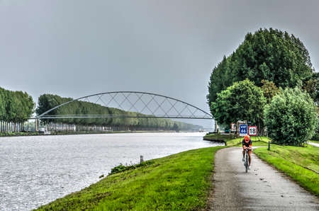 Nigtevecht, The Netherlands, August 25, 2018: view across the Amsterdam-Rhine canal towards the new bridge for pedestrians and bicyclistsのeditorial素材