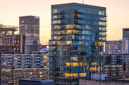 Rotterdam, The Netherlands, August 31, 2018: the B'tower residential building by architect Wiel Arets (2012) with its transparent glass facades at duskのeditorial素材