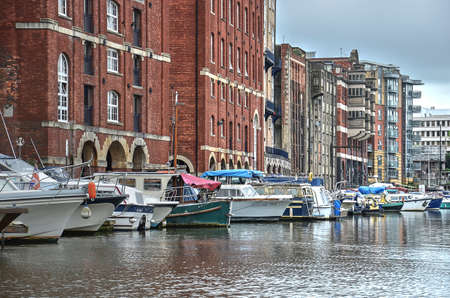 Bristol, England, June 2, 2014: view of the Floating Harbour lined with old warehouses and modern yachtsのeditorial素材