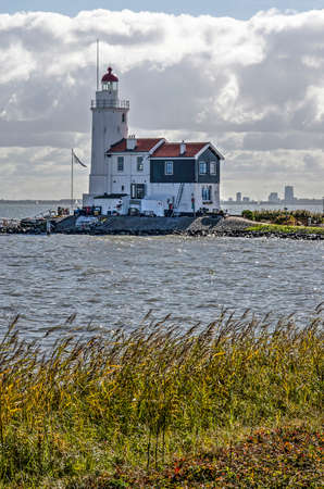 Marken, The Netherlands, October 7, 2018: view towards the historic lighthouse Het Paard (The Horse) on its little peninsula on the eastern cape of the islandのeditorial素材