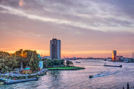 Rotterdam, The Netherlands, October 12, 2018: spectacular sunset sky over the Nieuwe Maas river and the Charloisse Hoofd and Lloydkwartier residential districtsのeditorial素材