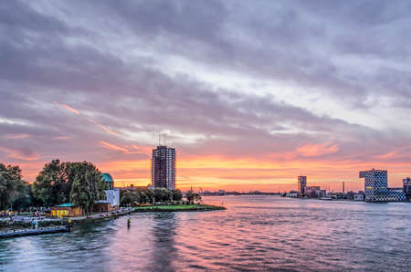 Rotterdam, The Netherlands, October 12, 2018: the Nieuwe Maas river and adjacent neighbourhoods of charlois and Lloydkwartier shortly after sunsetのeditorial素材