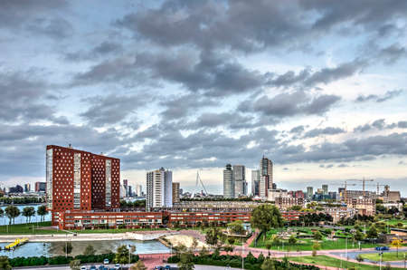 Rotterdam, The Netherlands, october 12, 2018: Dramatic cloudy sky over the upcoming neighbourhood of...