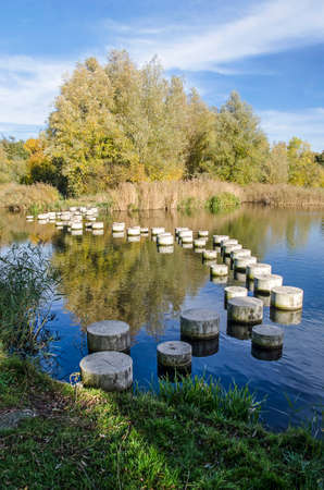 Rotterdam, The Netherlands, November 6, 2018: photo inportrait orientation of the stepping stones in a little lake in Zuidelijk Randparkのeditorial素材