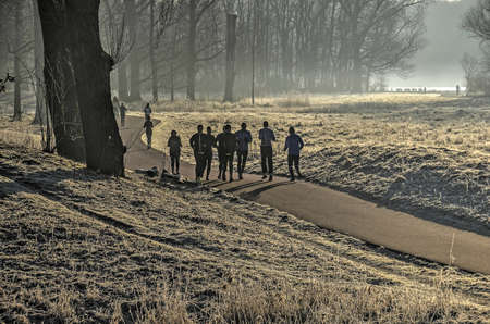 Rotterdam, the Netherlands, January 22, 2017: in spite of the cold, people are running through the...