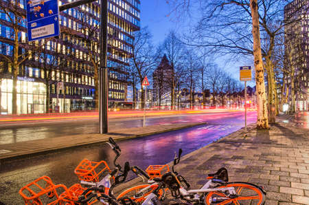 Rotterdam, The Netherlands, January 9, 2019: view of Blaak boulevard during morning rush hour with two fallen orange bicycles in the foregroundのeditorial素材
