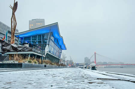 Rotterdam, The Netherlands, February 1, 2019: a thin layer of snow cover the quay of the river...