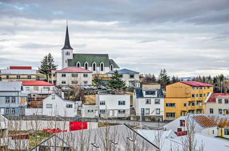 Borgarnes, Iceland, February 28, 2019: Colorful houses of corrugated steel, wood and concrete around...