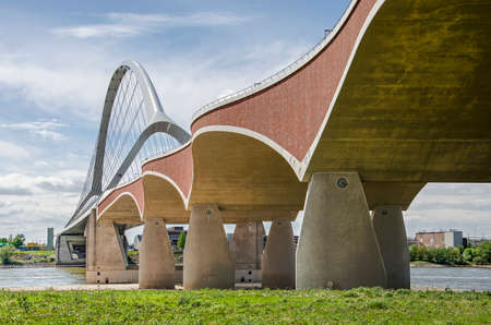 Nijmegen, The Netherlands, April 25, 2019: concrete, brick and steel are used in new city bridge De...