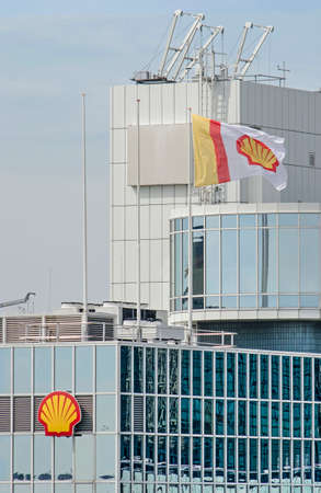 Rotterdam, The Netherlands, June 2, 2019: Logo and flag of oil company Shell on the Weena Central office buildingのeditorial素材
