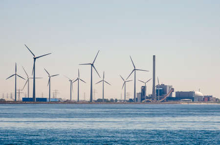 Vlissingen, The Netherlands, June 29, 2019: view across Westerschelde estuary towards the windturbines of Sloe industrial zone and the Borssele nuclear power plantのeditorial素材