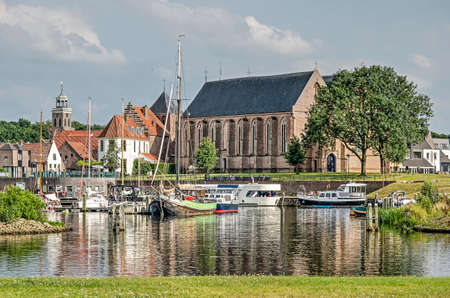 Vollenhove, The Netherlands, August 4, 2019: the town's former sea front with church and marina seen...