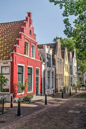 Harlingen, The Netherlands, July 26, 2019: street in the old town with colorful facades of traditional brick housesのeditorial素材