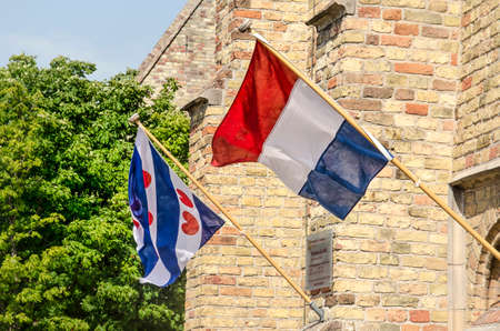 Franeker, The Netherlands, July 27, 2019: The flags of The Netherlands and the province of Fryslan...