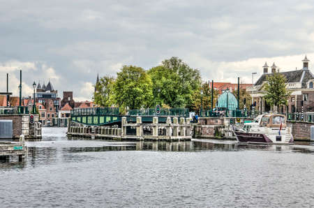 Haarlem, The Netherlands, September 9, 2019: Catharijne bridge across the Spaarne river rotates open to let a small yacht passのeditorial素材