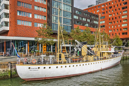 Rotterdam, The Netherlands, October 3, 2019: historic multi-functional navy vessel Castor moored in Rijnhaven harbour with Montevideo residential building in the backgroundのeditorial素材