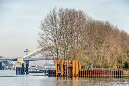Rotterdam, The Netherlands, November 24, 2019: view across the water towards the new viewing platform on Brienenoord island with  Brienenoord bridge in the backgroundのeditorial素材