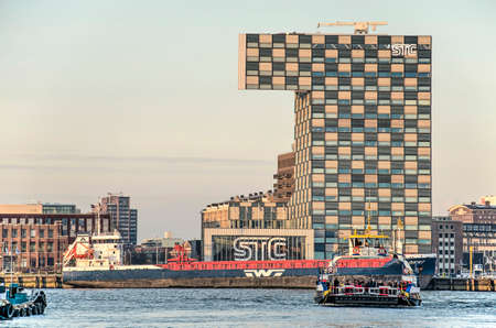 Rotterdam, The Netherlands, December 3, 2019: view across the river Nieuwe Maas with the passenger...