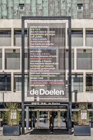 Rotterdam, The Netherlands, April 5, 2020: banner with the city's watchword "stronger through struggle" in 25 languages at the entrance of concert hall De Doelen, closed due to covid-19のeditorial素材