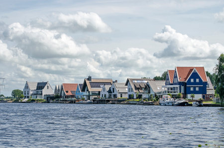 Grafhorst, The Netherlands, August 2, 2020: row of recently constructed luxury houses with traditional elements in various material including wood, plaster and brickのeditorial素材