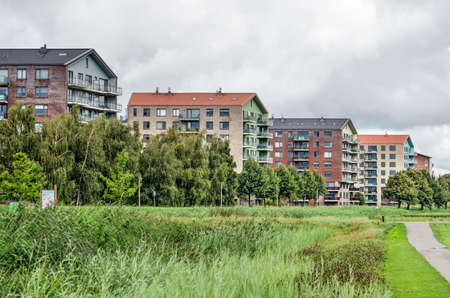 Lansingerland, The Netherlands, August 29, 2020: colorful group of apartment buildings on the edge of Annie MG Schmidt parkのeditorial素材