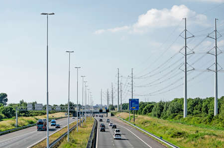Delft, The Netherlands, June 13, 2020: view from a viaduct on the A4 motorway towards Rijswijk and...