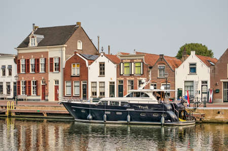 Middelharnis, The Netherlands, September 11, 2020: luxury yacht moored in the old town's harbor on a sunny day in late summerのeditorial素材