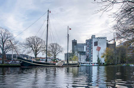 Leiden, The Netherlands, November 14, 2020: view of the city's ramparts canal with a historic...