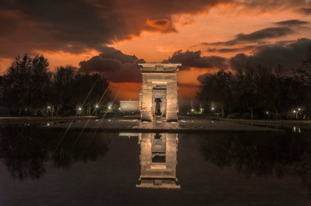 sunset view at the temple of debod in the city of madrid with reflections in the water urban photographyのeditorial素材