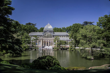 Photograph of the Crystal Palace in Retiro Park in Madrid with blue skyのeditorial素材