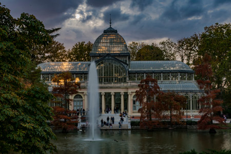 sunset over the crystal palace with the reflections in the lake in the city of madridのeditorial素材