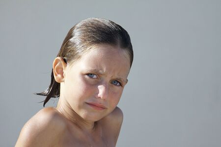 a caucasian child with a sad look on her faceの写真素材