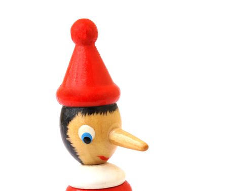 pinocchio wooden puppet with a long nose depicting a liarの写真素材