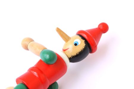 pinocchio wooden puppet isolated on a white backgroundの写真素材