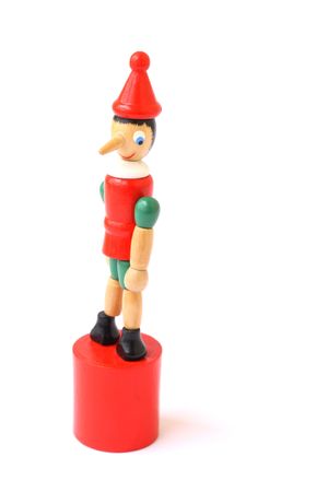 pinocchio wooden puppet isolated on a white backgroundの写真素材