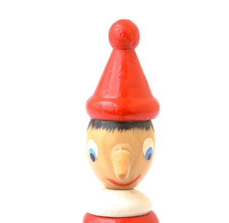 pinocchio wooden portrait depicting a liar isolated on a white backgroundの写真素材