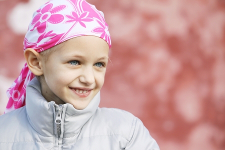 beautiful caucasian girl wearing a head scarf due to hair loss from chemotherapy fighting cancer の写真素材