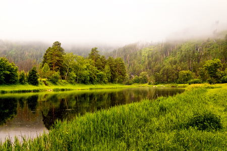 Landscape with river and fresh meadowsの写真素材
