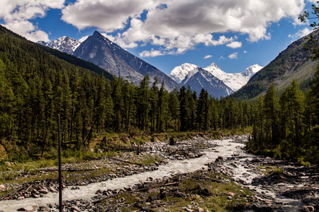 High mountain peaks, rapid river and trail on the shore. natural Park Beluhaの写真素材