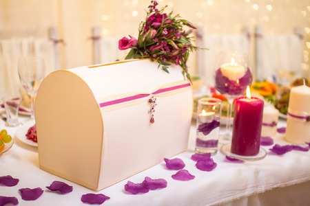 Wedding table decoration with box in lilac colorの写真素材