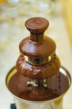 Tall chocolate fountain at a wedding receptionの写真素材