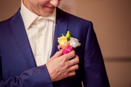 On the groom's jacket attached flower