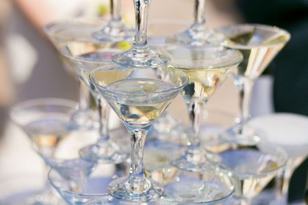 pyramid of champagne glasses at wedding banquetの写真素材