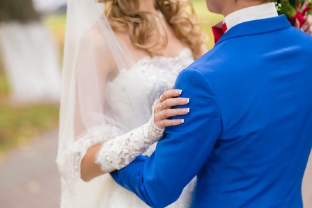 The bride and groom holding each otherの写真素材