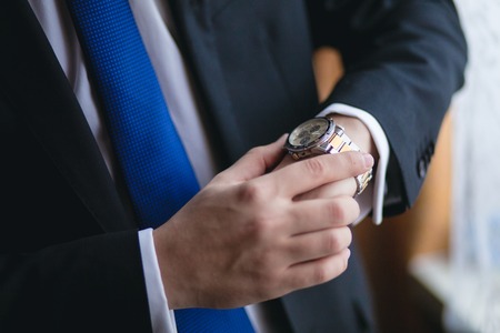 Businessman looking at his watchの写真素材
