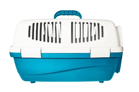 Plastic cage carrying for dogs and cats isolated on white. Travel transportation, veterinary clinic and pet care conceptの写真素材