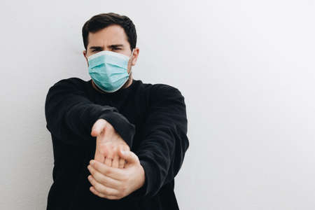 Man is stretching his hands before he exercises.の写真素材