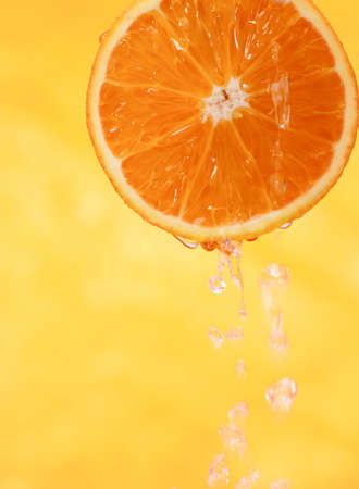 Sliced fresh orange with juiceの写真素材