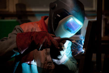 Factory welder doing his job